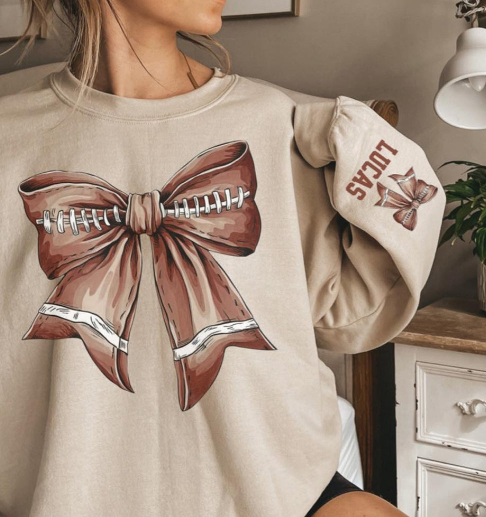 Football bow sweatshirt with name on sleeve